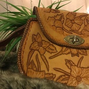 leather bag with unique flower carvings